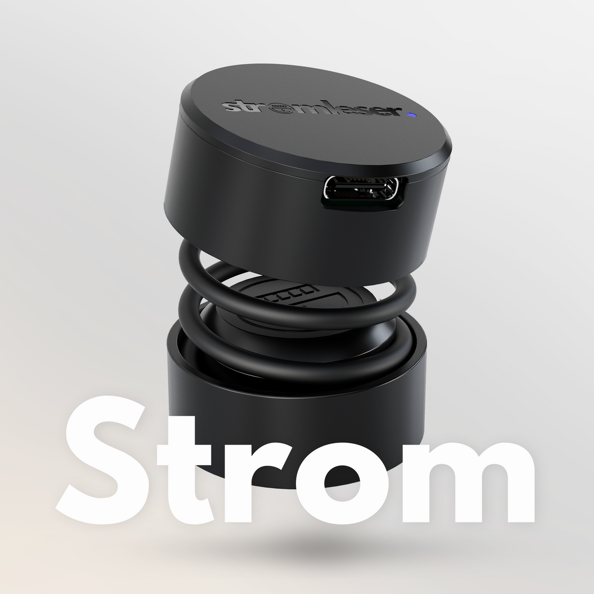 stromleser Stromzähler-Sensor in Schwarz, zylindrische Form mit USB-Anschluss, verbunden mit einer Feder über einem Sockel, mit großem ‘Strom’-Schriftzug darunter.
